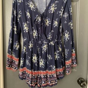 Long sleeved floral/tribal romper with pockets